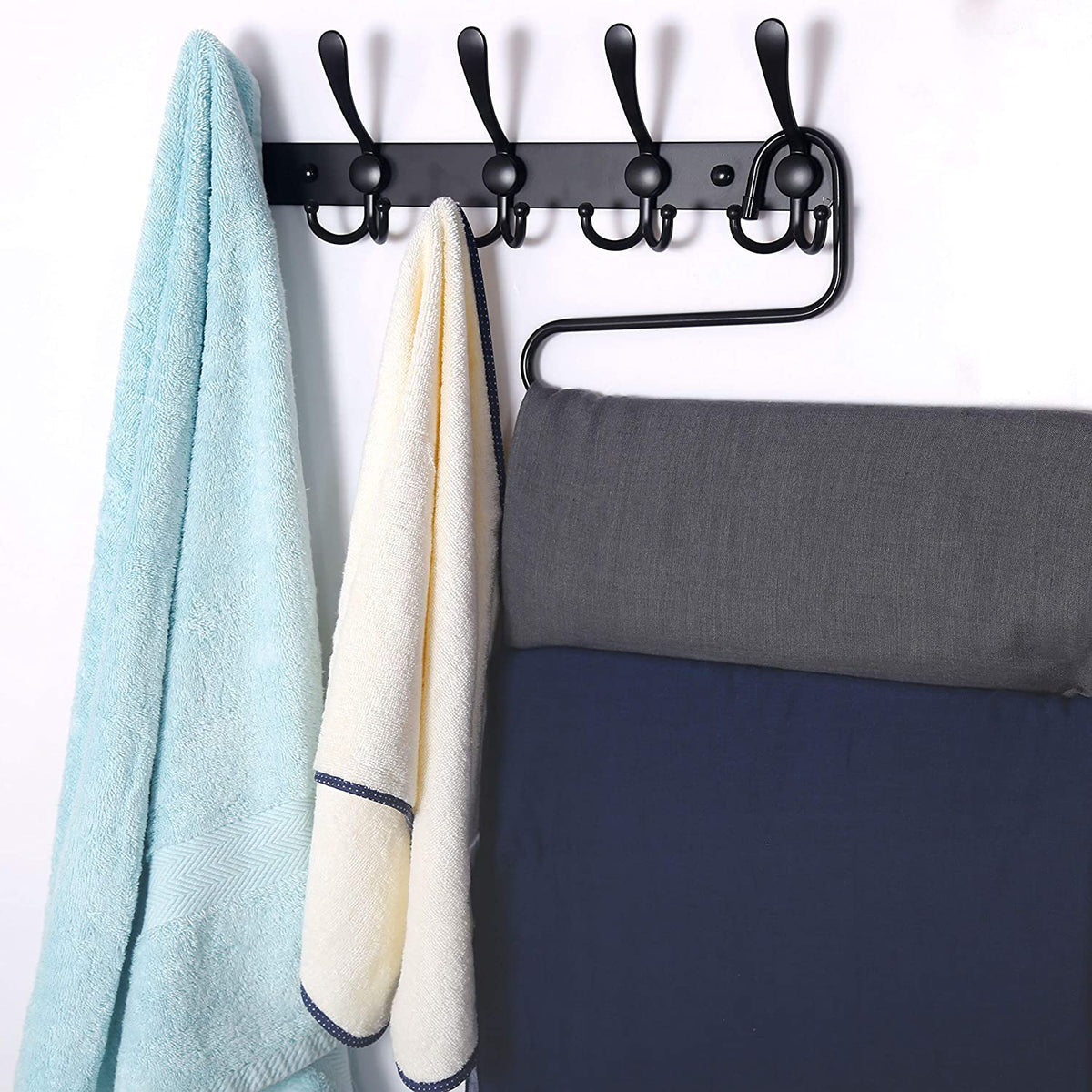 Coats and bags hanging from the triple hooks