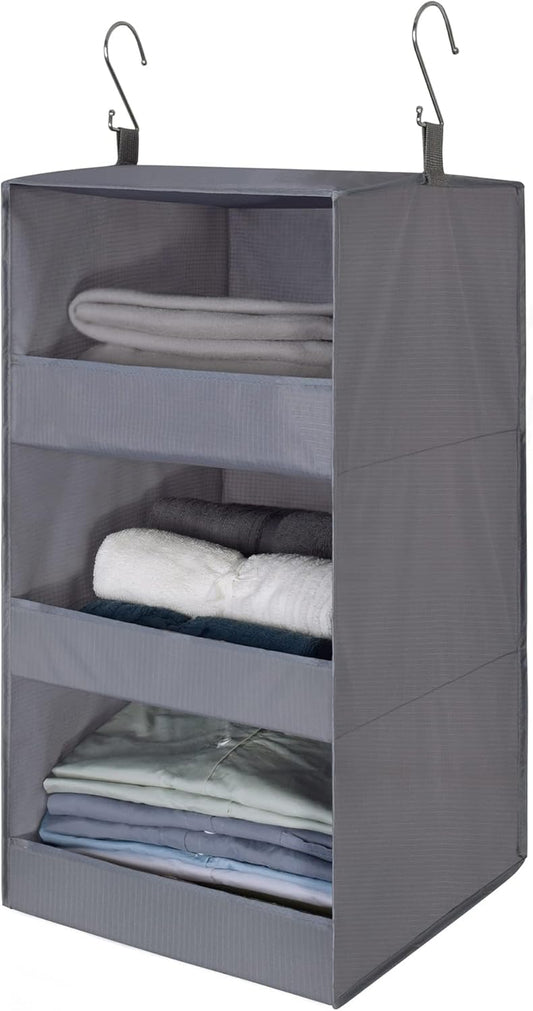 Three-tier grey hanging wardrobe shelves on a rail
