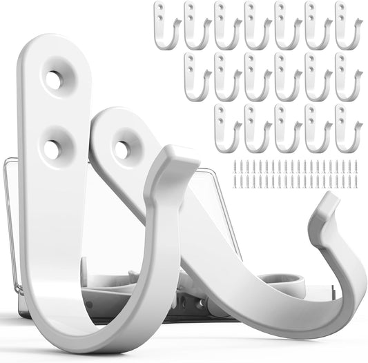 Twenty small white iron wall hooks laid out