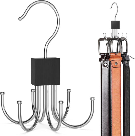 Black rotating belt hanger loaded with belts on a wardrobe rail